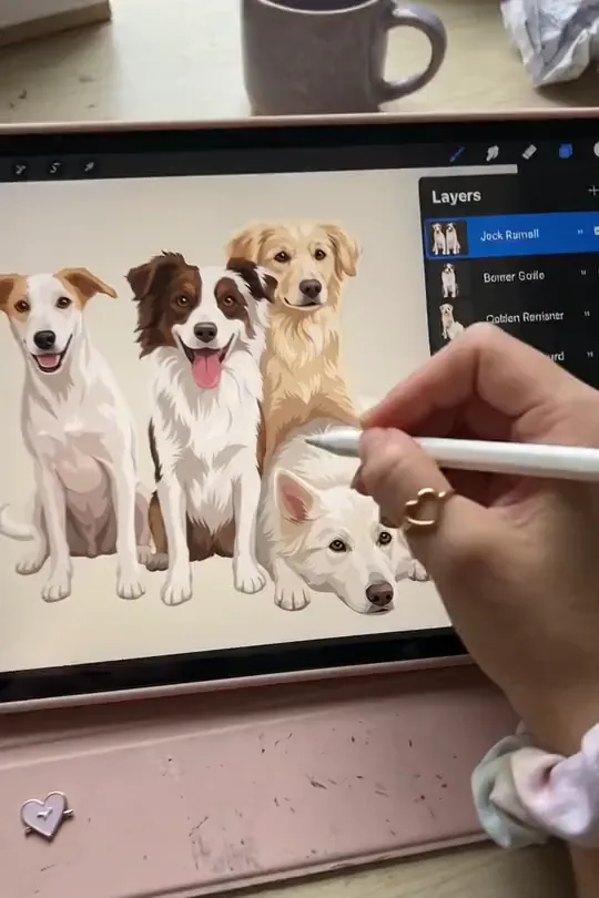An artist finishing a group of custom dog Pawtraits on a tablet